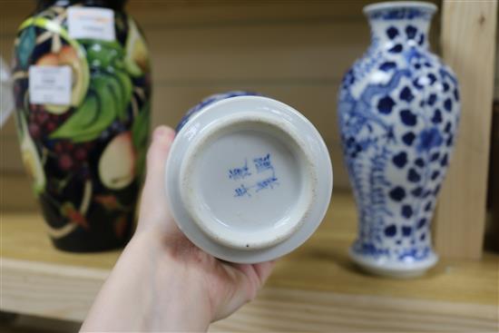 A pair of Chinese blue and white vases 23cm.